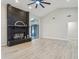 Spacious living room with a vaulted ceiling, wood-look floors, and a striking brick fireplace at 216 Shady Oaks Cir, Lake Mary, FL 32746