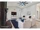Bright living room showcases a brick fireplace, neutral decor, and comfortable seating at 216 Shady Oaks Cir, Lake Mary, FL 32746