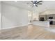 Open-concept floor plan with wood-look floors and a seamless flow to the kitchen area at 216 Shady Oaks Cir, Lake Mary, FL 32746