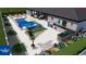The backyard pool studio with chairs, table, and outdoor kitchen provides an outdoor oasis at 216 Shady Oaks Cir, Lake Mary, FL 32746