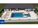 The backyard pool studio with chairs, table, and umbrella provides an outdoor oasis at 216 Shady Oaks Cir, Lake Mary, FL 32746
