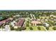 Expansive aerial shot showcases community amenities, including a pond, green spaces, and well-manicured landscaping at 2167 Velvet Leaf Dr, Ocoee, FL 34761