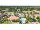 Overhead view of community amenities, including pool, playground, lake, and well-maintained landscaping at 2167 Velvet Leaf Dr, Ocoee, FL 34761
