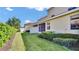 Well-maintained backyard with verdant grass, privacy fence, and a screened-in patio, perfect for relaxation at 2167 Velvet Leaf Dr, Ocoee, FL 34761
