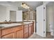 Bathroom showcasing double sinks, granite countertops, and a glass-enclosed shower at 2167 Velvet Leaf Dr, Ocoee, FL 34761