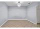 Dining space with modern light fixture, tile flooring, and neutral wall paint at 2167 Velvet Leaf Dr, Ocoee, FL 34761
