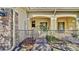 Charming front entrance with a decorative metal gate and covered porch area at 2167 Velvet Leaf Dr, Ocoee, FL 34761