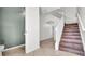Open foyer featuring stairs to the upper level and neutral tile flooring at 2167 Velvet Leaf Dr, Ocoee, FL 34761