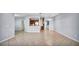 Bright open-concept living space with a view of the dining area and modern kitchen at 2167 Velvet Leaf Dr, Ocoee, FL 34761