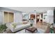 Bright, open living space with comfortable sofa, seamless connection to dining and kitchen areas at 2167 Velvet Leaf Dr, Ocoee, FL 34761