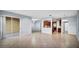 Expansive open-concept space with tile floors connecting the living room, kitchen, and dining area at 2167 Velvet Leaf Dr, Ocoee, FL 34761