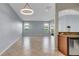 Bright and airy living room with tile flooring and modern lighting fixture at 2167 Velvet Leaf Dr, Ocoee, FL 34761