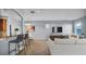 Bright living room featuring tile flooring, stylish bar stools, and comfortable seating at 2167 Velvet Leaf Dr, Ocoee, FL 34761