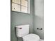 Simple powder room with a white toilet and vintage bronze hardware at 2167 Velvet Leaf Dr, Ocoee, FL 34761