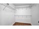 Walk-in closet with wire shelving and wood flooring at 2167 Velvet Leaf Dr, Ocoee, FL 34761