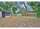 Large, leafy backyard with a mix of sun and shade and a screened patio at 217 E Hillcrest St, Altamonte Springs, FL 32701