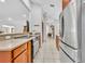 Open-concept kitchen featuring stainless steel appliances, granite countertops, and a spacious layout at 217 E Hillcrest St, Altamonte Springs, FL 32701
