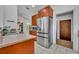 Spacious kitchen featuring stainless steel refrigerator and a view of the breakfast bar at 217 E Hillcrest St, Altamonte Springs, FL 32701