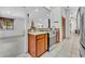 Kitchen with granite countertops and stainless steel appliances open to the living area at 217 E Hillcrest St, Altamonte Springs, FL 32701