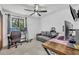 Home office with two workstations, a comfortable loveseat, modern lighting, and a ceiling fan at 217 E Hillcrest St, Altamonte Springs, FL 32701