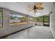 Screened-in back porch with a ceiling fan offering an open view of the private backyard at 217 E Hillcrest St, Altamonte Springs, FL 32701
