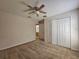 Bedroom with closet, carpeted floor and doorway to the bathroom at 224 Lake Charles Dr, Davenport, FL 33837