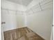 Walk-in closet featuring wire shelving, carpeted floor and a simple design at 224 Lake Charles Dr, Davenport, FL 33837