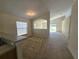 Cozy living room with carpet flooring, neutral paint, and natural light flowing in from the windows at 224 Lake Charles Dr, Davenport, FL 33837