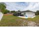 Back yard with screened porch, grassy area, patio and play area at 2259 King Johns Ct, Winter Park, FL 32792