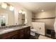 Modern bathroom features granite-style double sink vanity, sleek fixtures, and tiled shower with unique accent tile at 2259 King Johns Ct, Winter Park, FL 32792