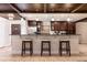 Gorgeous kitchen featuring sleek countertops, stainless steel appliances, and stylish barstool seating at the island at 2259 King Johns Ct, Winter Park, FL 32792