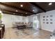 Relaxing living room with a cozy sofa, designer rug, and access to the patio through sliding glass doors at 2259 King Johns Ct, Winter Park, FL 32792