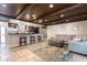 Open-concept living space that flows into the kitchen, with a spacious sofa and breakfast bar seating at 2259 King Johns Ct, Winter Park, FL 32792
