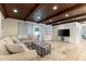 Inviting living room with a comfortable sectional sofa, a modern coffee table, and a stylish entertainment center at 2259 King Johns Ct, Winter Park, FL 32792