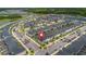 This bird's-eye perspective reveals a meticulously organized layout of residential homes with dedicated parking spaces within a community at 2400 Reading Trl, Kissimmee, FL 34746