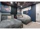 A Marvel-themed bedroom featuring two beds and a striking Avenger's theme ceiling and wall decor at 2400 Reading Trl, Kissimmee, FL 34746