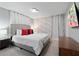 Tastefully decorated bedroom with a comfortable bed and ample natural light at 2400 Reading Trl, Kissimmee, FL 34746