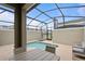 Private screened-in pool with seating area, perfect for outdoor relaxation and entertainment at 2400 Reading Trl, Kissimmee, FL 34746
