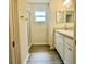A bathroom featuring a standing shower and a vanity with wood laminate flooring at 2607 Tulip Dr, Davenport, FL 33837