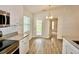 An eat-in kitchen with stainless steel appliances, granite countertops and wood laminate flooring at 2607 Tulip Dr, Davenport, FL 33837