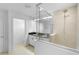 Bathroom showcasing double vanity, a glass enclosed shower, and bright lighting at 2730 Parkfield Rd, St Cloud, FL 34772