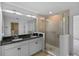 Bathroom featuring double vanity, a glass shower, and bright lighting at 2730 Parkfield Rd, St Cloud, FL 34772