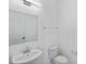 Clean and functional powder room featuring a pedestal sink, toilet, and a well-lit mirror at 2730 Parkfield Rd, St Cloud, FL 34772