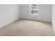 Bedroom features neutral carpet and a bright window at 2730 Parkfield Rd, St Cloud, FL 34772