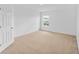 Bright bedroom showcasing neutral carpet and a well-lit interior at 2730 Parkfield Rd, St Cloud, FL 34772