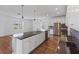 Modern kitchen with stainless steel appliances, a large island, and stylish pendant lighting at 2730 Parkfield Rd, St Cloud, FL 34772