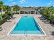Community pool with ample seating, palm trees, and a covered pavilion at 2730 Parkfield Rd, St Cloud, FL 34772