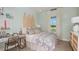 Beach themed bedroom with surf board headboard, decorated with a beachy theme and light colors at 2963 Arranmore Dr, Ormond Beach, FL 32174