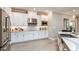 Kitchen showcasing stainless steel appliances, ample white cabinetry, and counter space, with wood flooring at 2963 Arranmore Dr, Ormond Beach, FL 32174