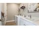 Functional laundry room with modern washer and dryer, storage, and utility sink with countertop space at 2963 Arranmore Dr, Ormond Beach, FL 32174